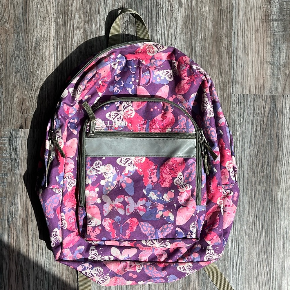 Classic L.L. Bean backpack with pink & purple butterflies embroidered D on front